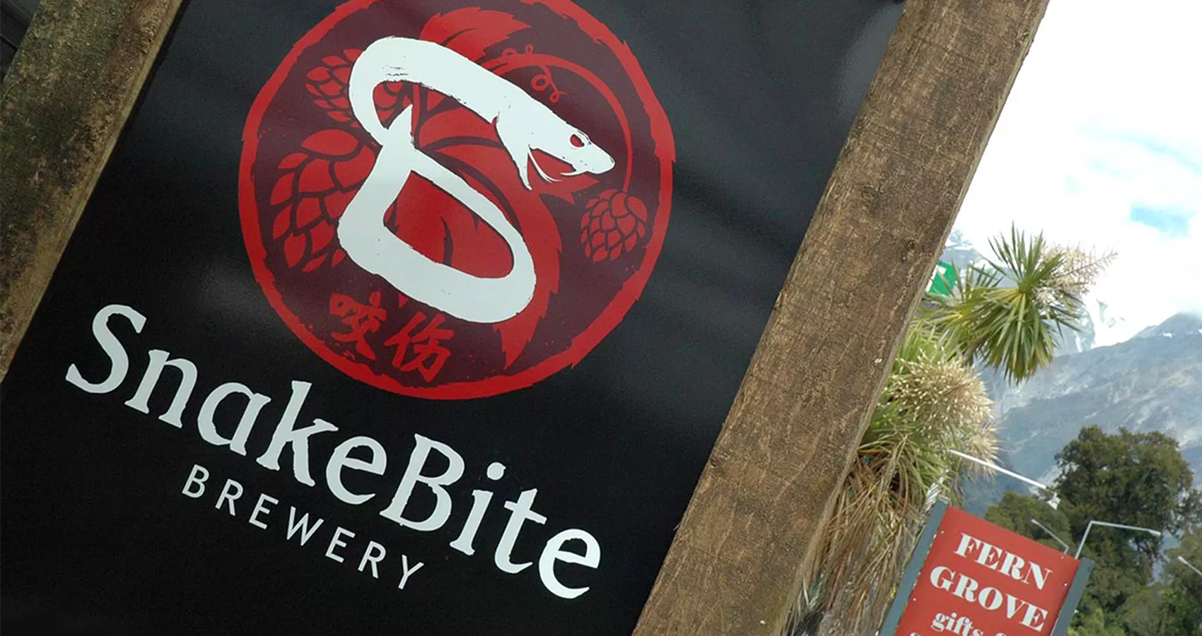 logo design for SnakeBite Brewery Franz Josef