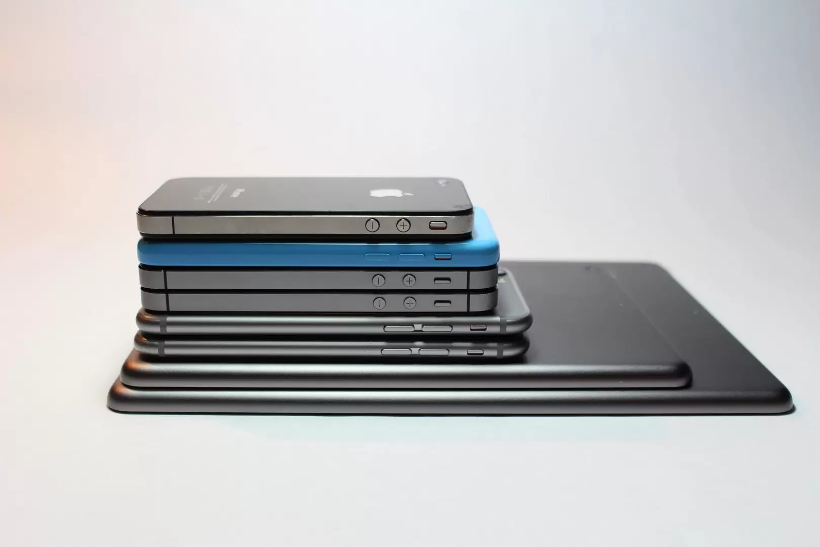 A stack of smartphones & tablets.