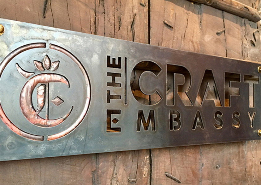 the craft embassy logo design signage